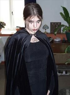 Girl in black cape
